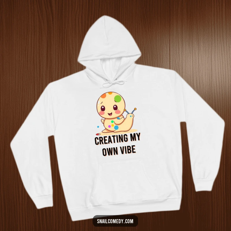 Funny snail hoodie featuring a snail painting a colorful dot, a warm and artistic piece of apparel.