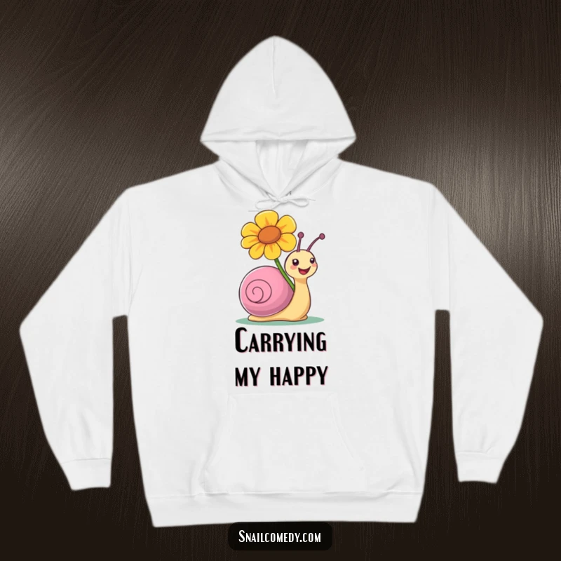 Funny hoodie with a snail character joyfully carrying a large, colorful flower, spreading cheer.