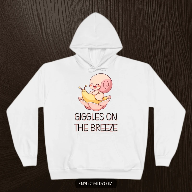 Funny hoodie featuring a snail giggling with delight while riding a floating petal. Cozy and cheerful.