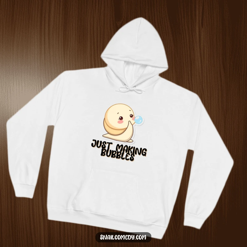 Funny hoodie depicting a baby snail character playfully blowing a tiny bubble, exuding charm.