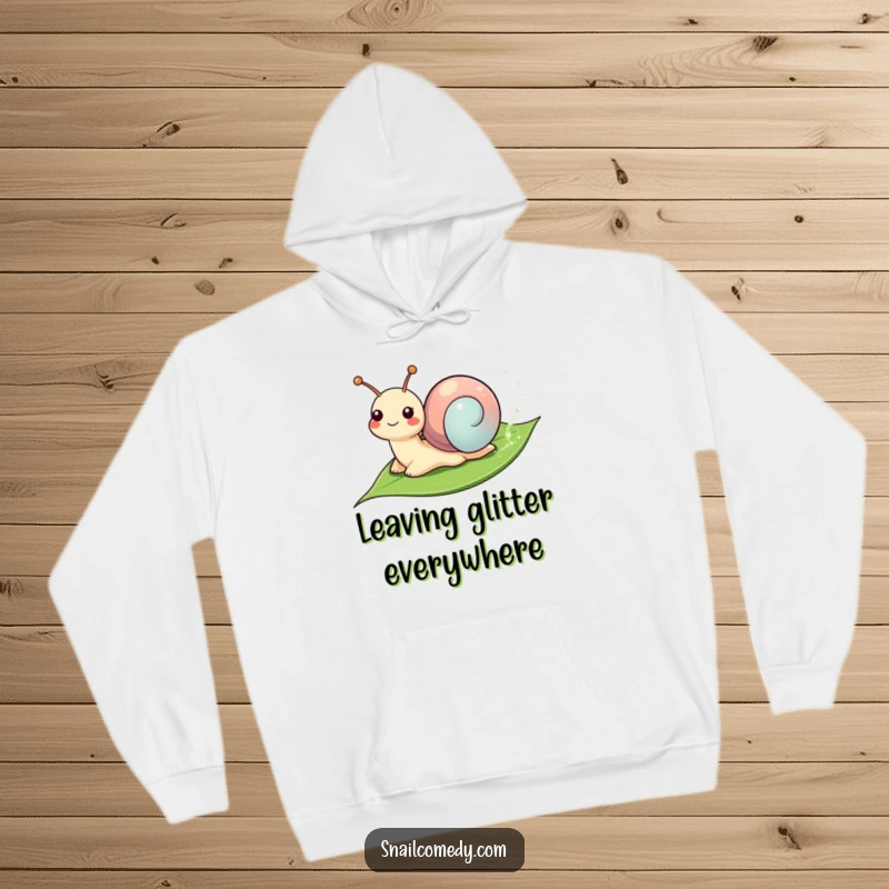 Funny Hoodie: Smiling snail leaving a sparkly trail on a leaf, perfect for cozying up and adding magic.