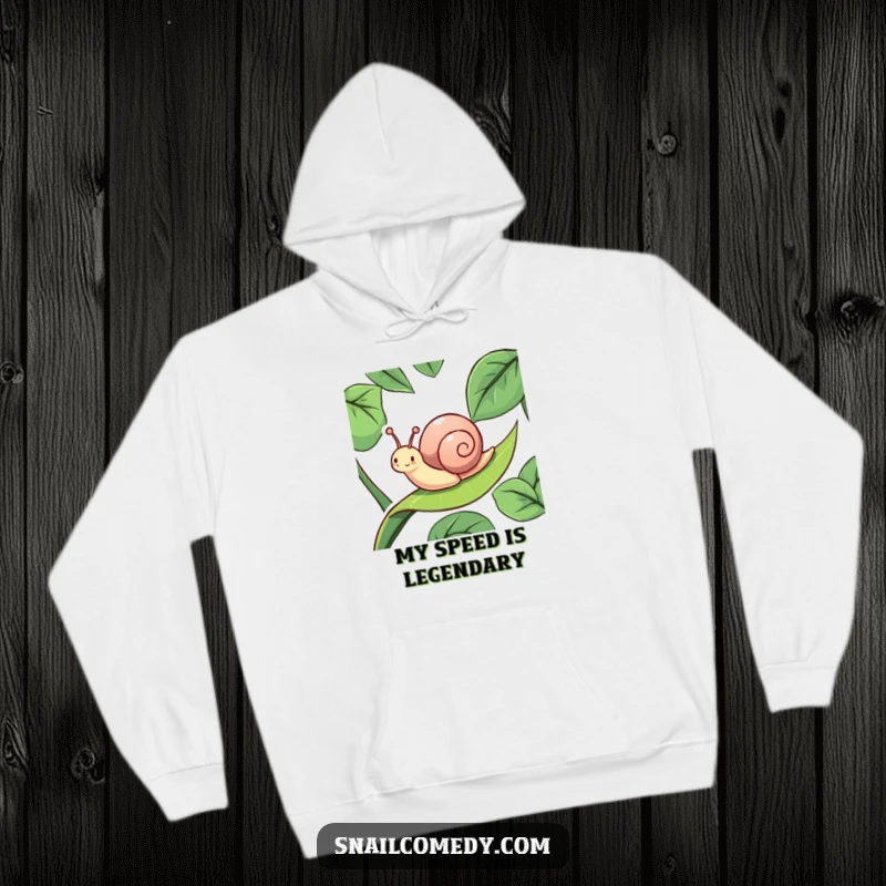 Funny, energetic snail sliding with delight down a slippery leaf, depicted on a cozy hoodie, a truly humorous apparel item.
