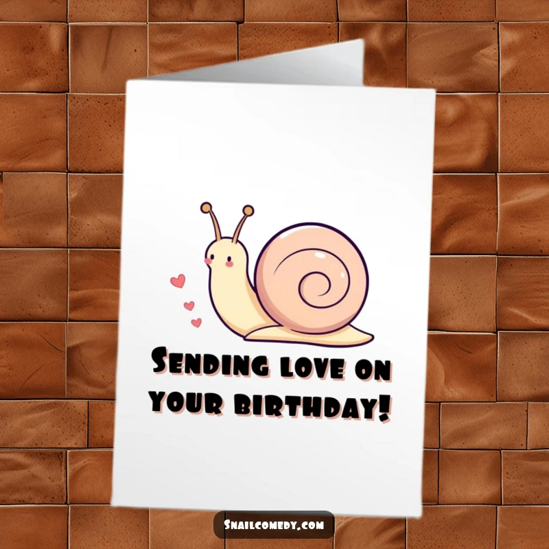 Funny Free Printable Birthday Card featuring a Kawaii snail leaving a cheerful trail of little hearts behind it as it moves along.