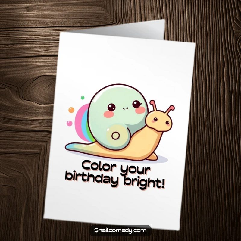 Funny Free Printable Birthday Card: A happy snail trails a vibrant rainbow across the card, bringing colorful birthday cheer.