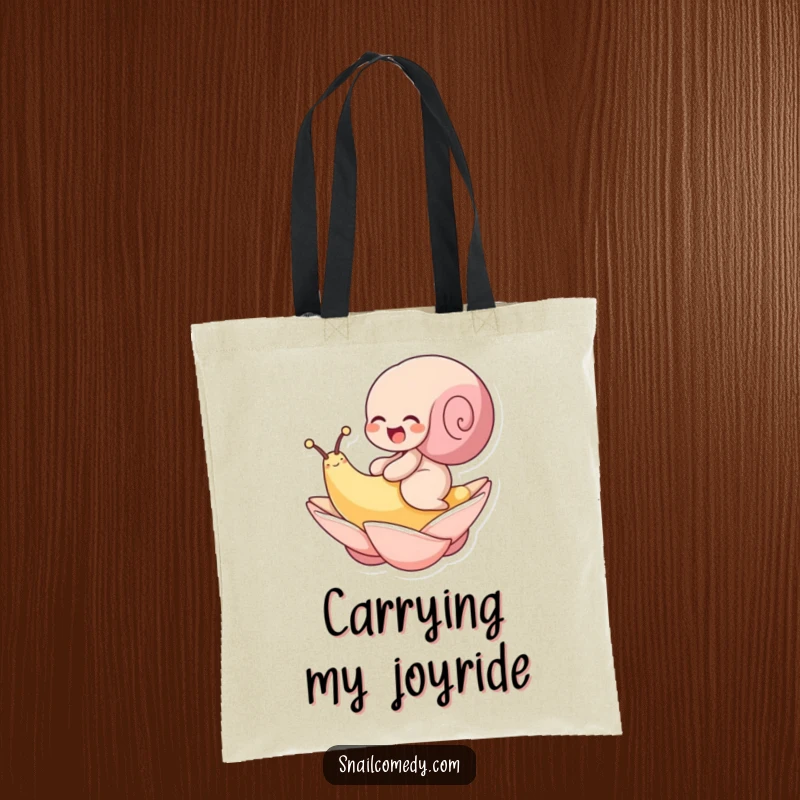 Funny tote bag with a snail hilariously giggling while riding a floating petal. Carry your joy with this bag.